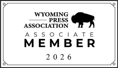 Black-and-white “Wyoming Press Association Associate Member 2026” badge featuring a buffalo silhouette, framed by a decorative border.